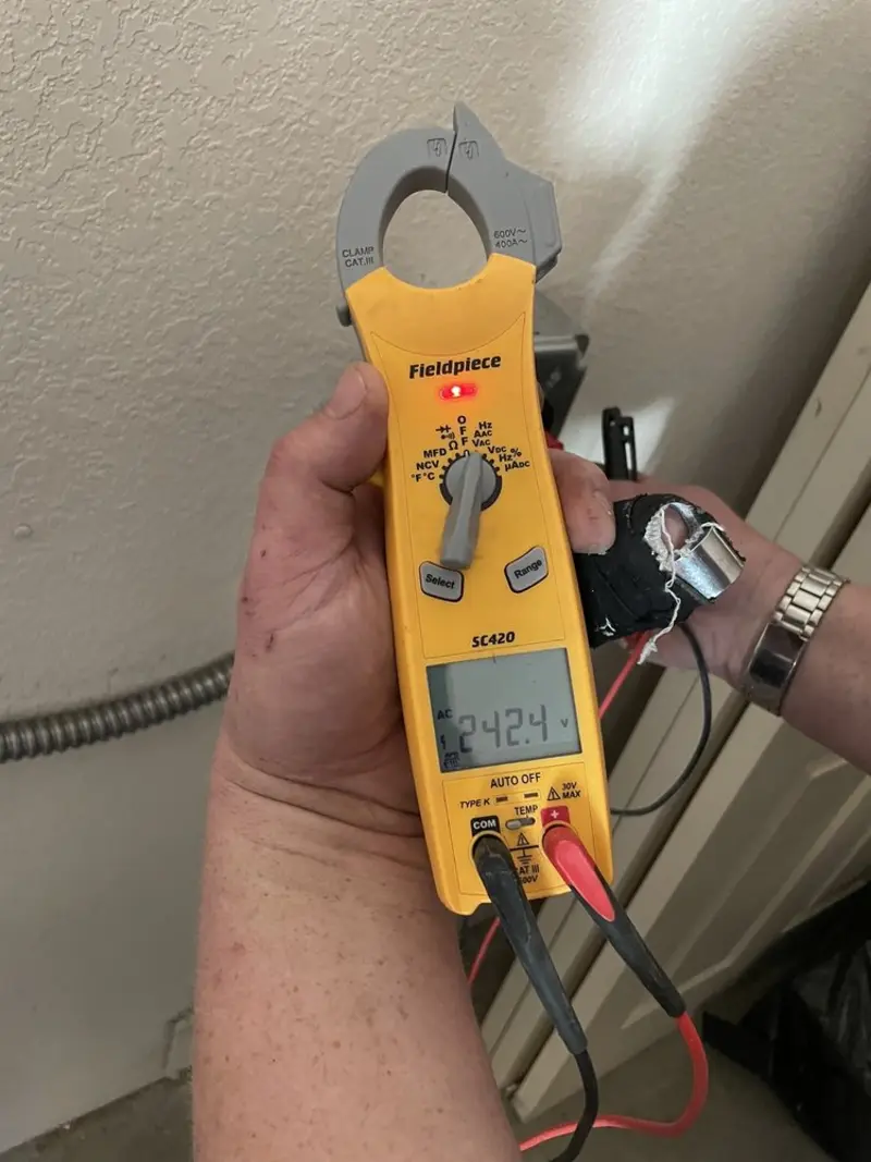 Voltage testing with clamp meter during Ceiling Fan Installation in Scott